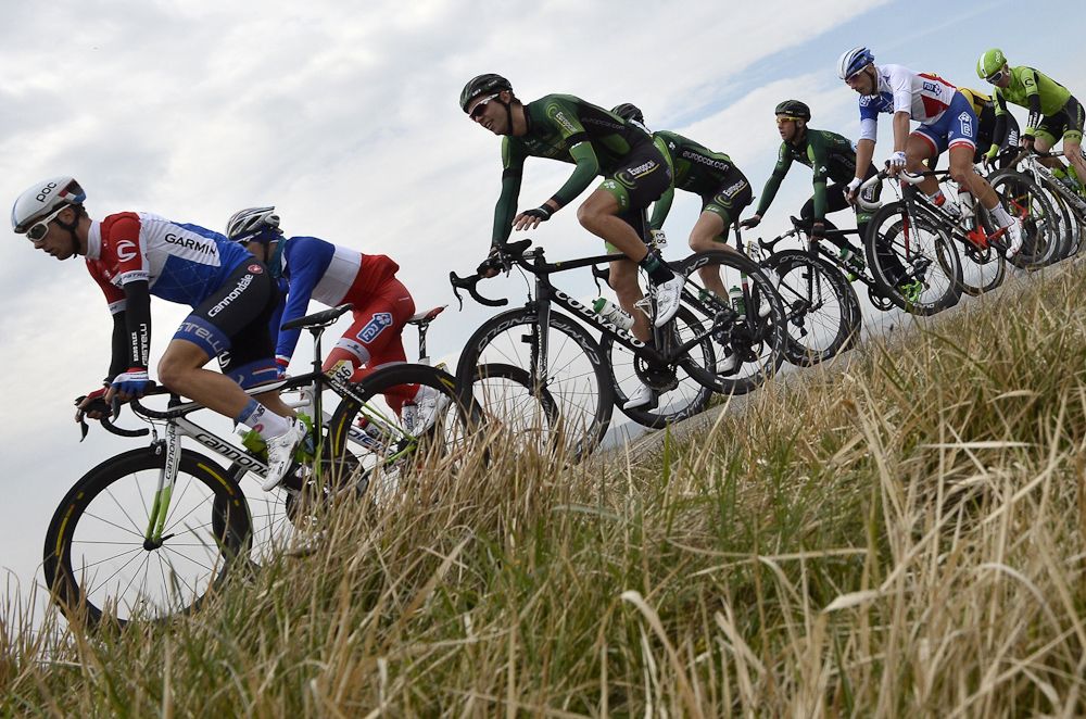 Sebastian Langeveld and France's Arnaud Demare ride in the pack.