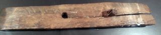 This wood fragment may be a boat patch. It was found at L'Anse aux Meadows, the only confirmed Viking settlement in North America. Viking ships likely sailed from L'Anse aux Meadows to Hop.