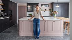 Emma Willis kitchen with black cabinets and dusky pink island