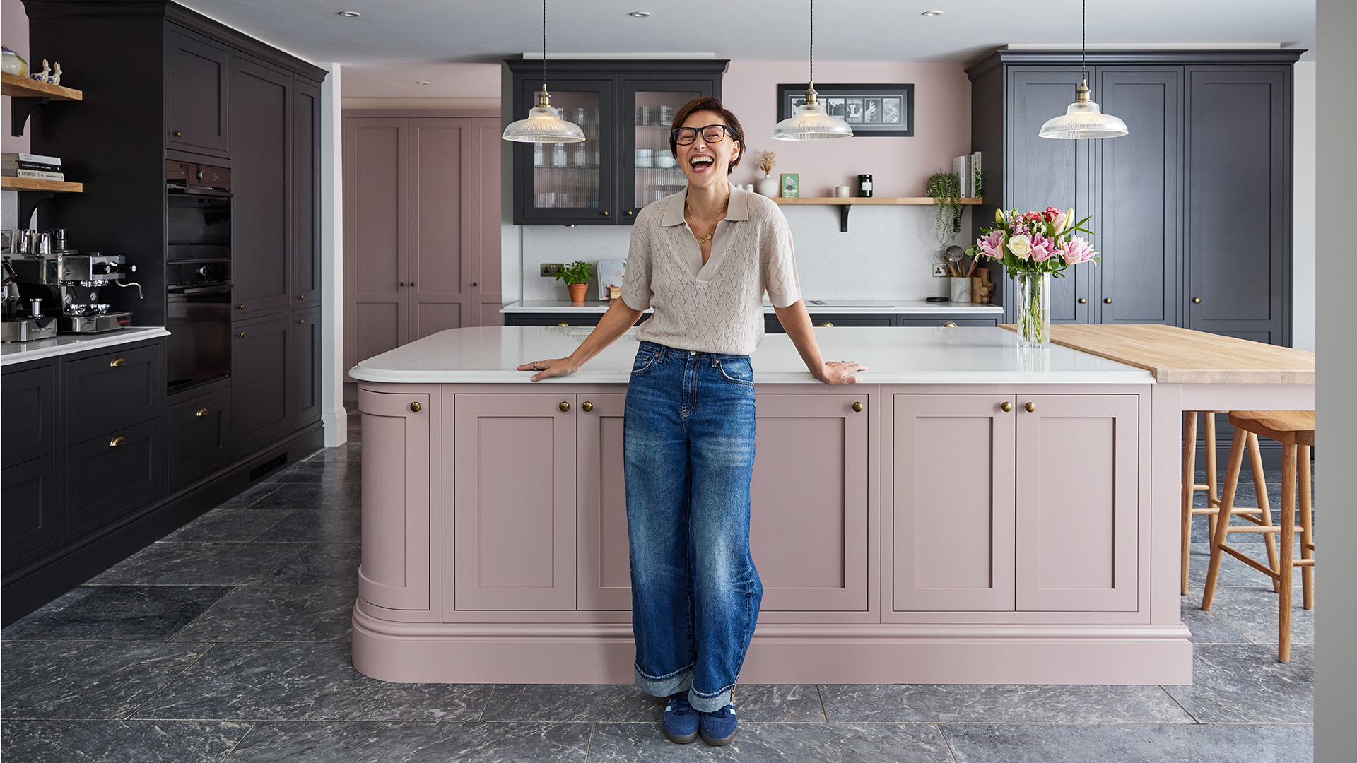 Emma Willis kitchen with black cabinets and dusky pink island