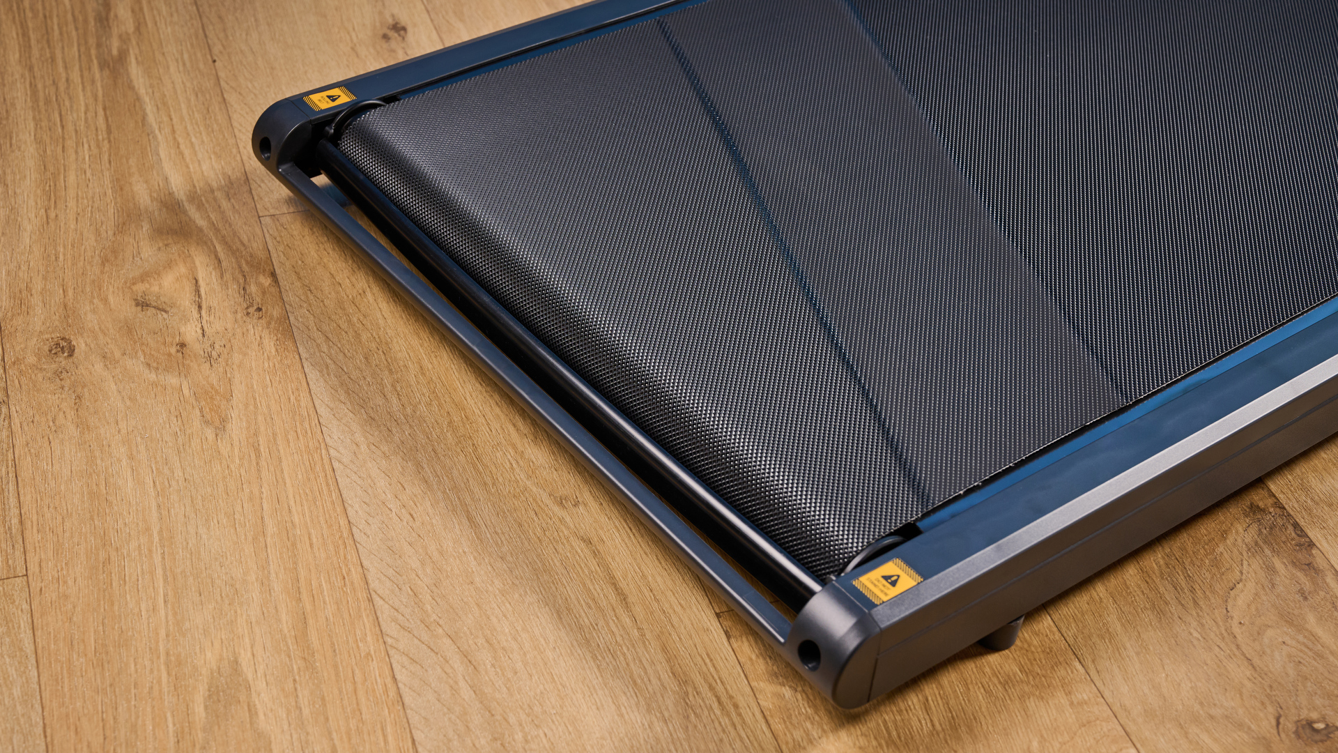The WalkingPad Z1 photographed in front of a blue background.