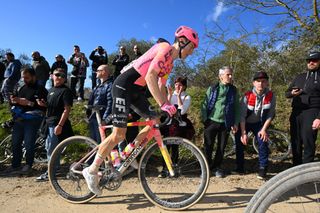 SIENA ITALY MARCH 02 Neilson Powless of The United States and Team EF Education EasyPost competes while fans cheer during the 18th Strade Bianche 2024 Mens Elite a 215km one day race from Siena to Siena 320m UCIWT on March 02 2024 in Siena Italy Photo by Tim de WaeleGetty Images