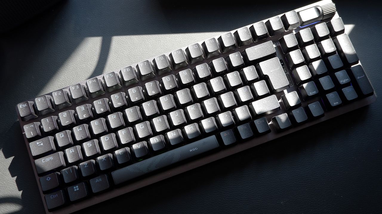 Asus ROG Strix Scope II 96 Wireless gaming keyboard on a desk.