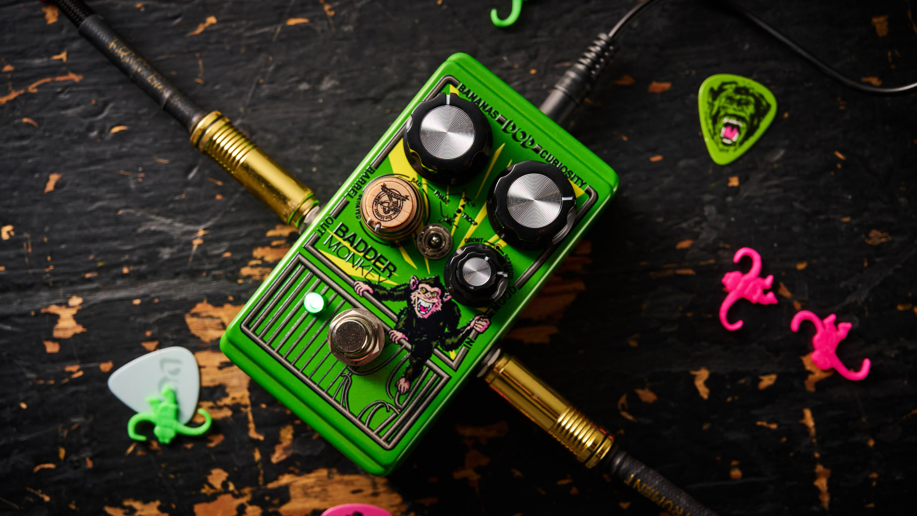 The DOD Badder Monkey is another little green overdrive pedal – but like no other. Pictured here against a distressed wooden floor, it has a wooden barrel control, and a primate illustration on the front.
