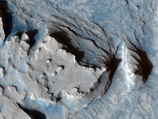 This Mars Reconnaissance Orbiter image (released Aug. 1, 2007) shows a ridge in Mars' Terra Meridiani that is most likely a former streambed, now exposed in inverted relief.