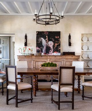 Dining table with dining chairs and arrangement of preserved moss in wooden box