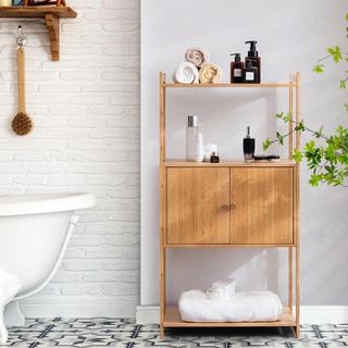 Wooden bathroom cabinet with towels
