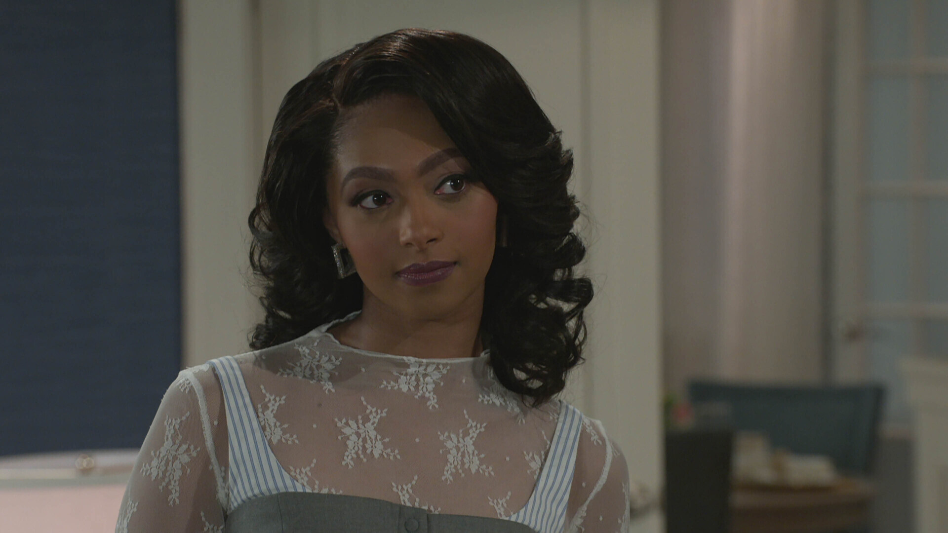 Colby Muhammad as Kat smirking in Beyond the Gates
