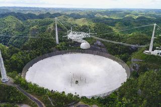 The massive dish at Arecibo Observatory as seen in spring 2019.