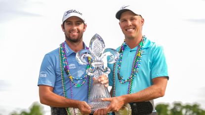 Davis Riley and Nick Hardy with the Zurich Classic of New Orleans trophy