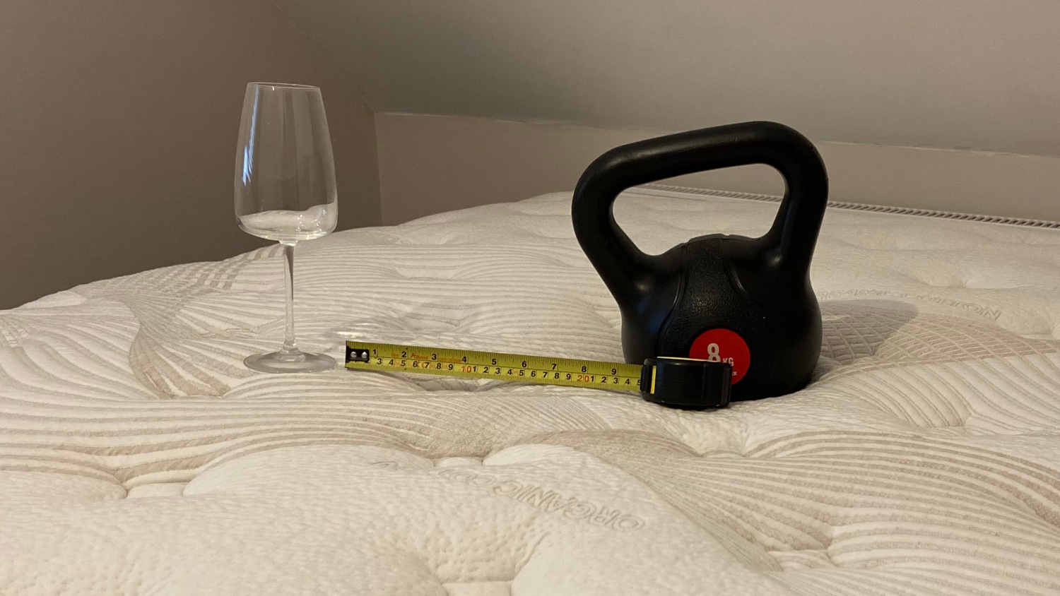 A wine glass, weight and tape measure on the Nolah Evolution 15