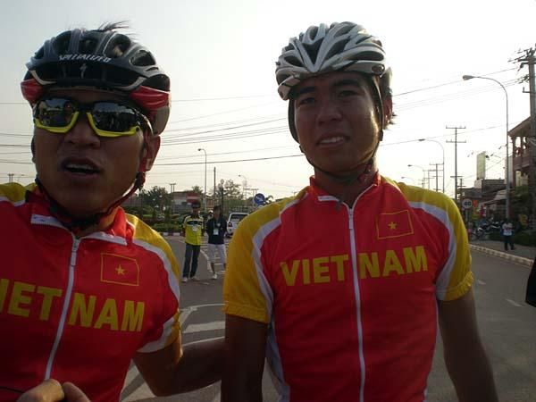 Two happy Vietnamese riders after the men's road race in which Vietnam took one-two.