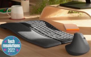 Logitech ergonomic keyboard and mouse on a desk