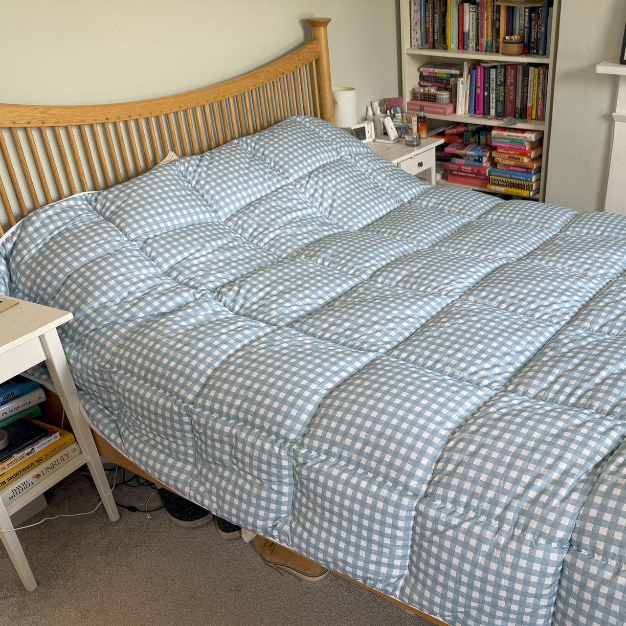 The blue gingham Night Lark Coverless Duvet being tested at home