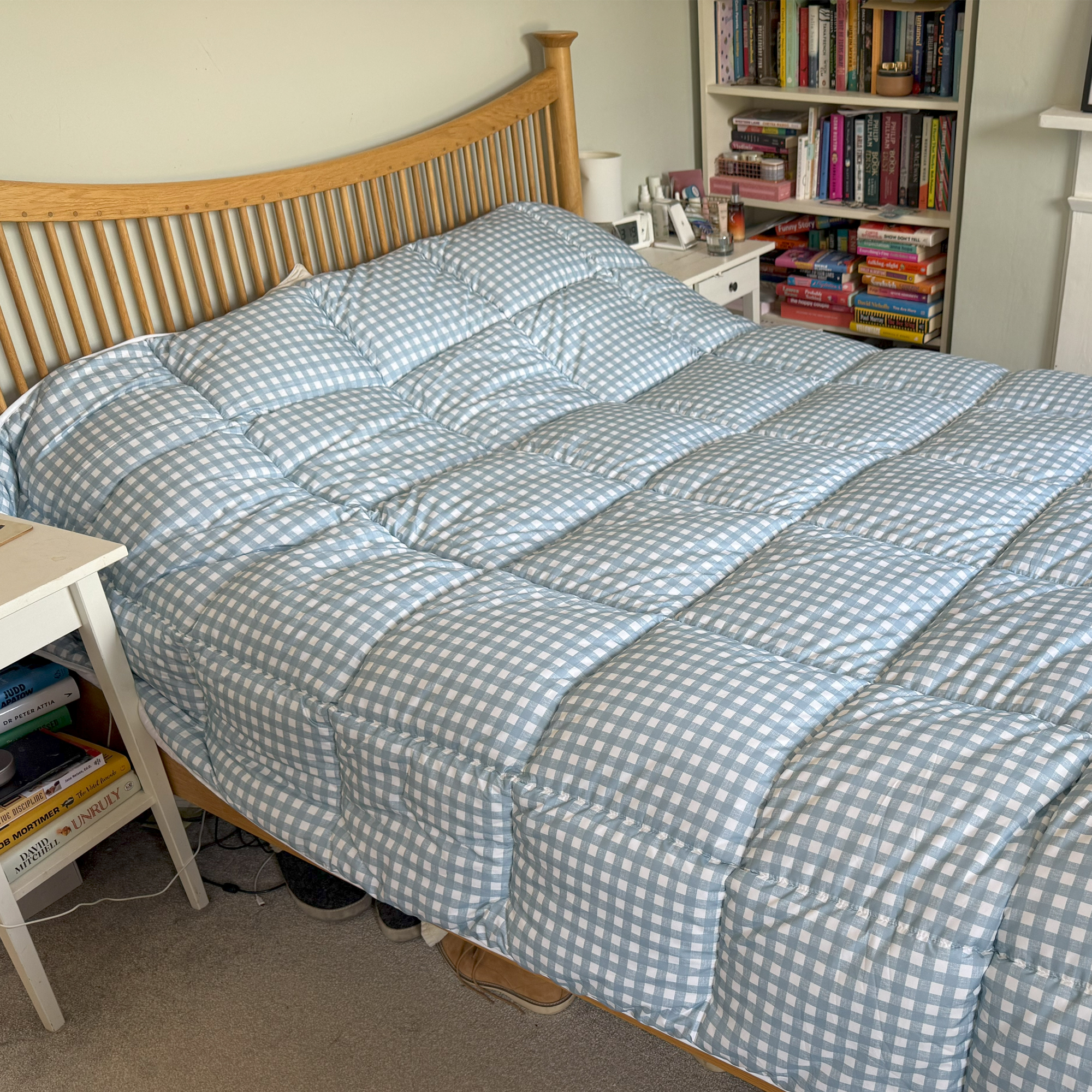 The blue gingham Night Lark Coverless Duvet being tested at home