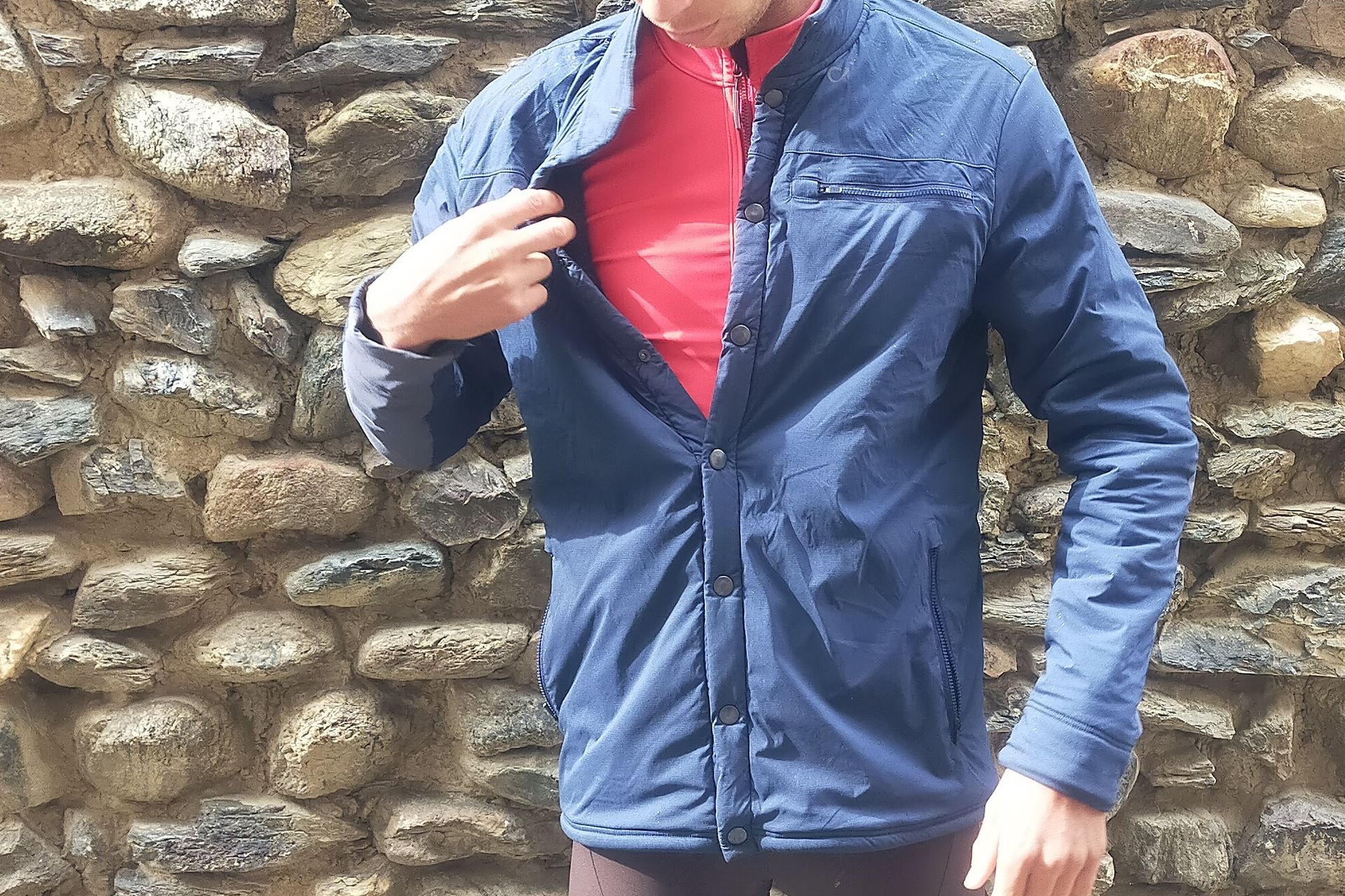 Image shows a rider wearing the Velocio Recon Snap Jacket