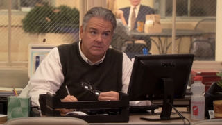 Jim O'Heir as Jerry Gergich looking apprehensive while sitting at desk in Season 2 episode of Parks and Recreation "The Practice Date "