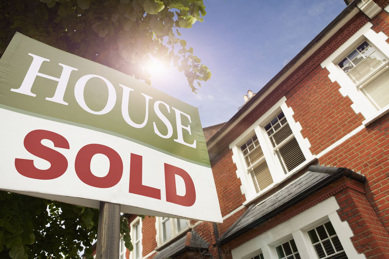 House prices as demonstrated by a &#039;for sale&#039; sign outside a home