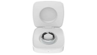 The silver Evie Ring sat in its portable charging case