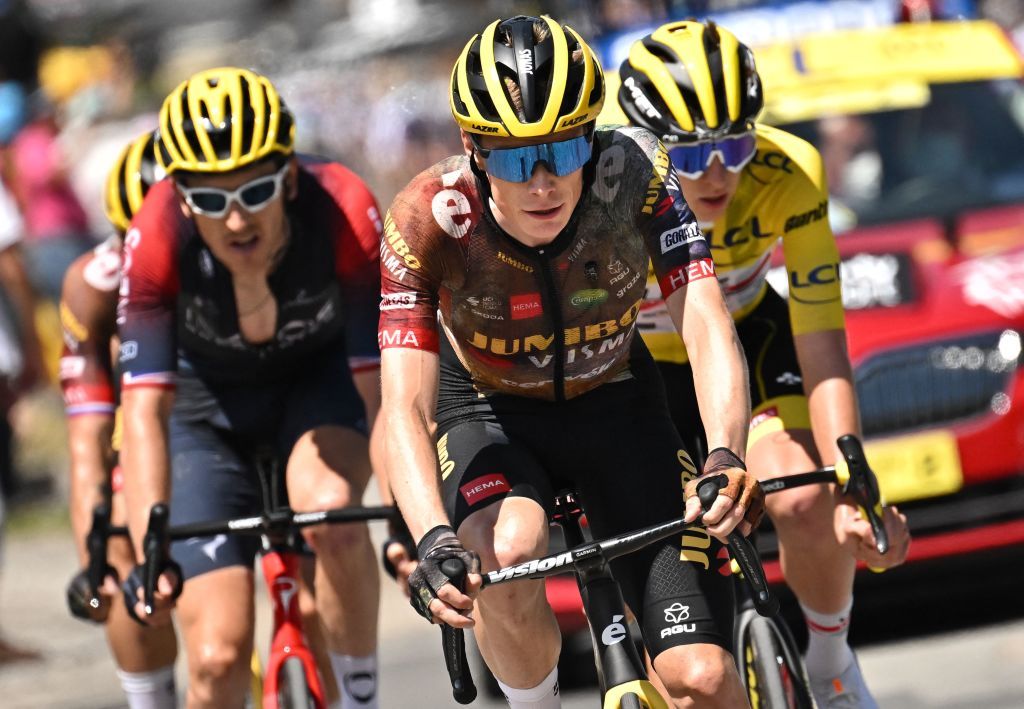 JumboVisma teams Danish rider Jonas Vingegaard C cycles ahead of Ineos Grenadiers teams British rider Geraint Thomas L and UAE Team Emirates teams Slovenian rider Tadej Pogacar R wearing the overall leaders yellow jersey during the 11th stage of the 109th edition of the Tour de France cycling race 1517 km between Albertville and Col du Granon Serre Chevalier in the French Alps on July 13 2022 Photo by Marco BERTORELLO AFP Photo by MARCO BERTORELLOAFP via Getty Images
