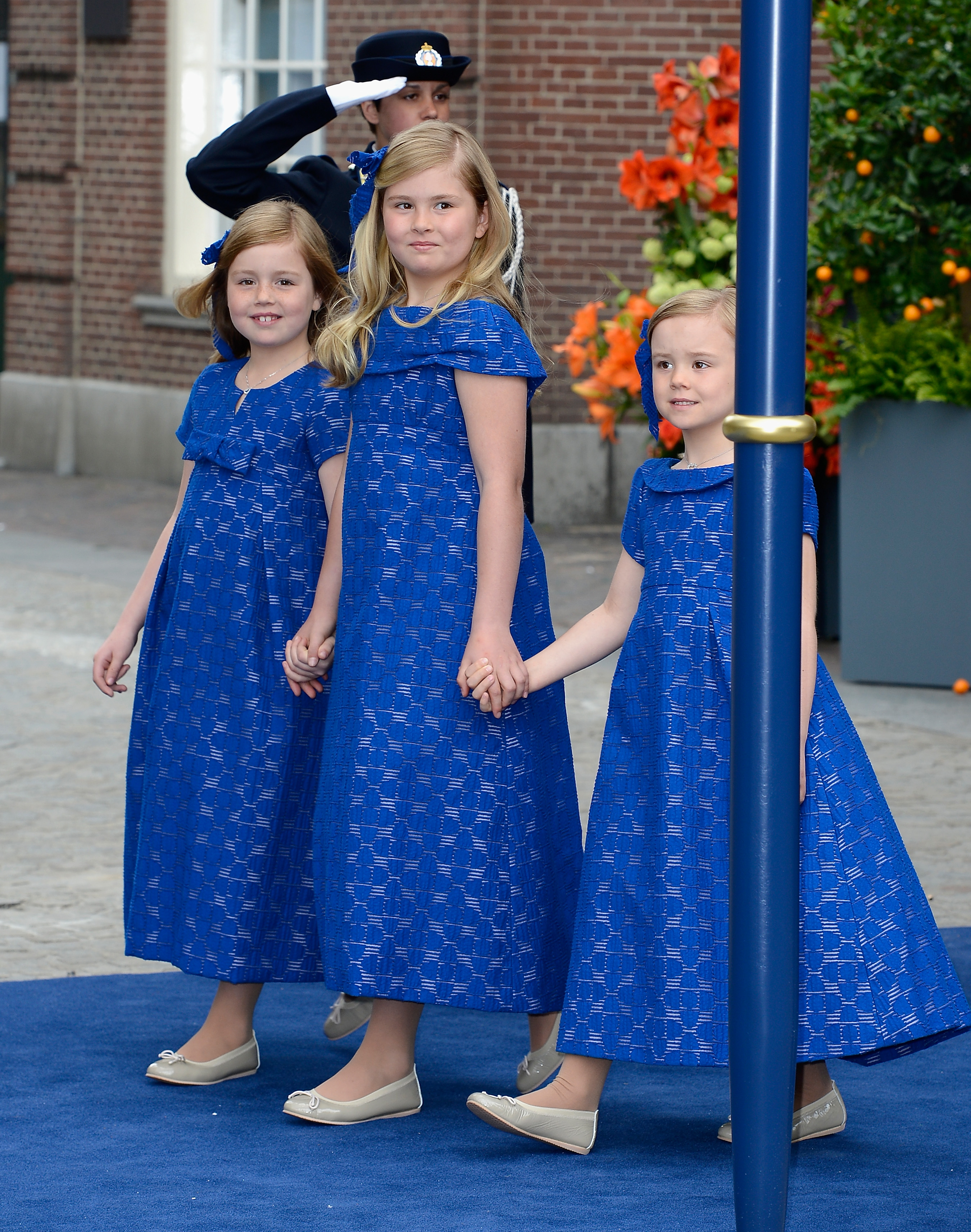Princess Alexia, Princess Catharina-Amalia and Princess Ariane of the Netherlands in blue dresses at their parents inauguration in 2013