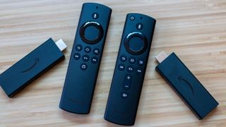 Amazon Fire TV Stick with remote next to Fire TV Stick Lite with remote