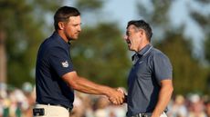 Bryson DeChambeau and Rory McIlroy shake hands after playing together at The Masters
