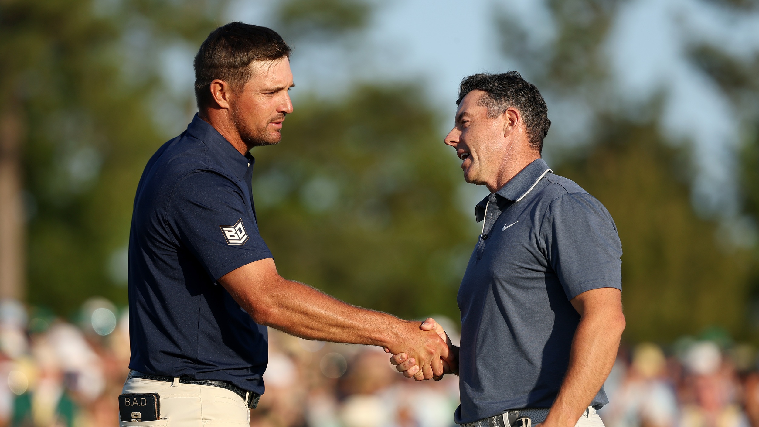 Bryson DeChambeau and Rory McIlroy shake hands after playing together at The Masters