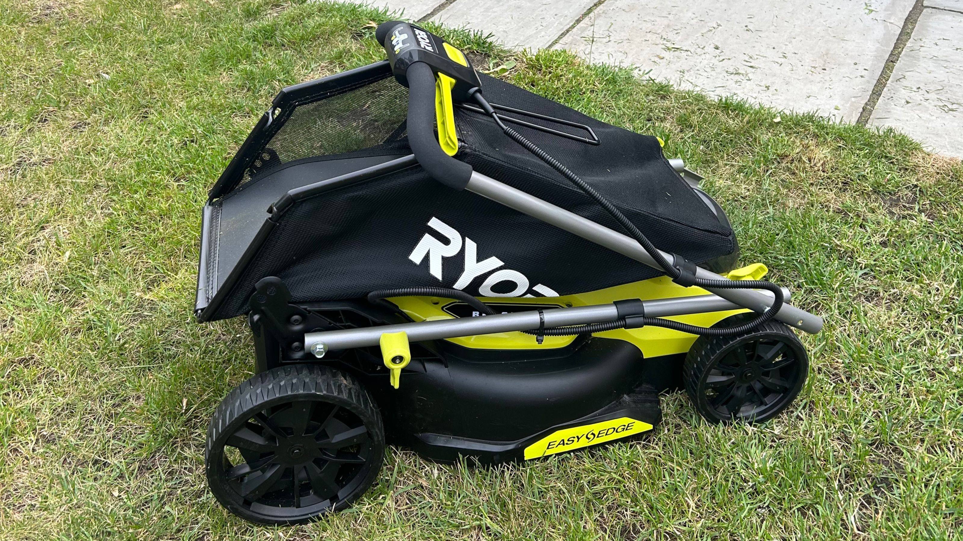Ryobi lawnmower folded on grass