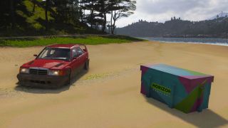 Forza Horizon 6 Ito Treasure Hunt: A red car parked on a beach next to a colourful treasure chest.