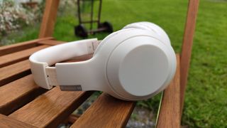 Temu headphones on a wooden chair 