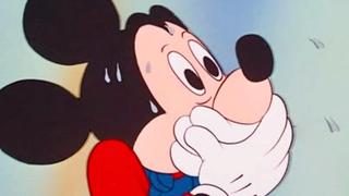 Surprised Mickey Mouse with hands over mouth