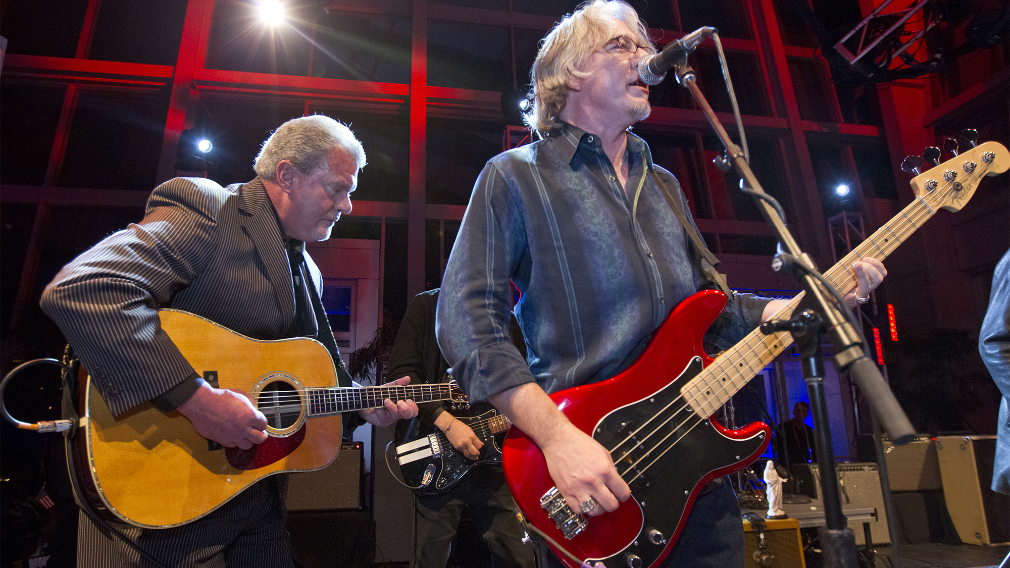 INDIANAPOLIS - FEBRUARY 2: Colts owner Jim Irsay plays rhythm guitar as bass player for REM, Mike Mills, takes the lead during a private Super Bowl party hosted by Irsay, owner of the Indianapolis Colts at the Indiana State Museum and Historic Sites on Thursday, Feb. 2, 2012.