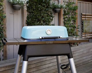 Everdure Force 2 BBQ in blue in garden