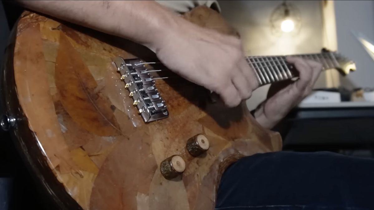 Marlon Roxas plays a guitar he made out of 10,000 leaves