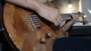 Marlon Roxas plays a guitar he made out of 10,000 leaves