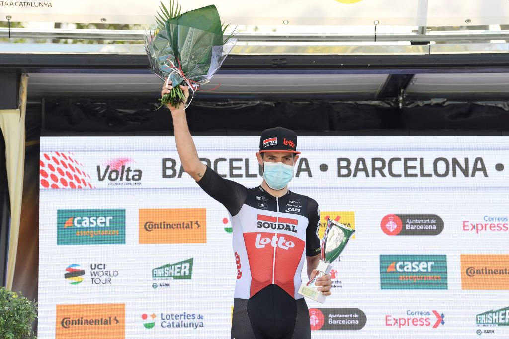 Team Lottos Belgian rider Thomas De Gendt celebrates on the podium after winning the final stage of the 100th Volta Catalunya 2021 a 133km race starting and finishing in Barcelona on March 28 2021 Photo by Josep LAGO  AFP Photo by JOSEP LAGOAFP via Getty Images