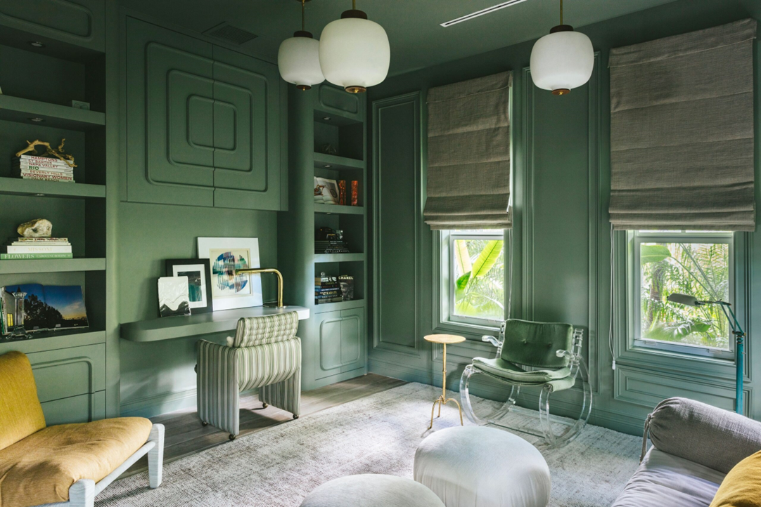 jade green home office with curved furniture and sofa bed