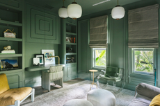 jade green home office with curved furniture and sofa bed