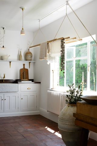 white country utility room with tiled floor