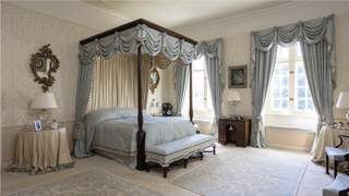 Cream and blue bedroom with four poster bed