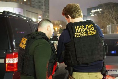 Federal agents participate in arrests Tuesday in New York.