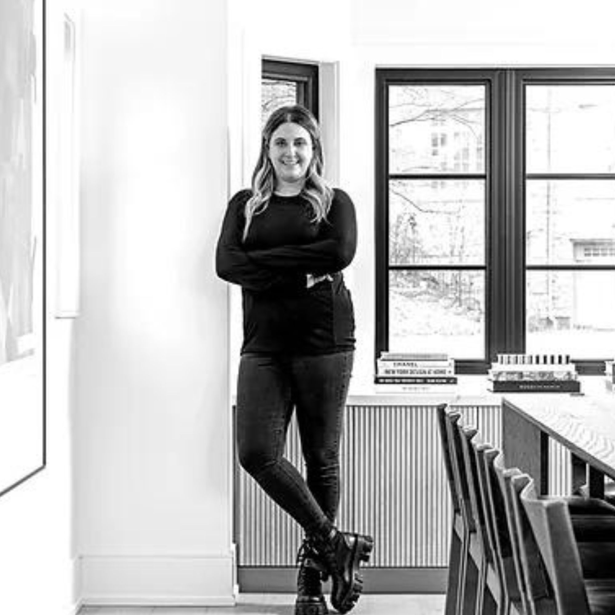 A black-and-white image of interior designer Shaunn Lipsey