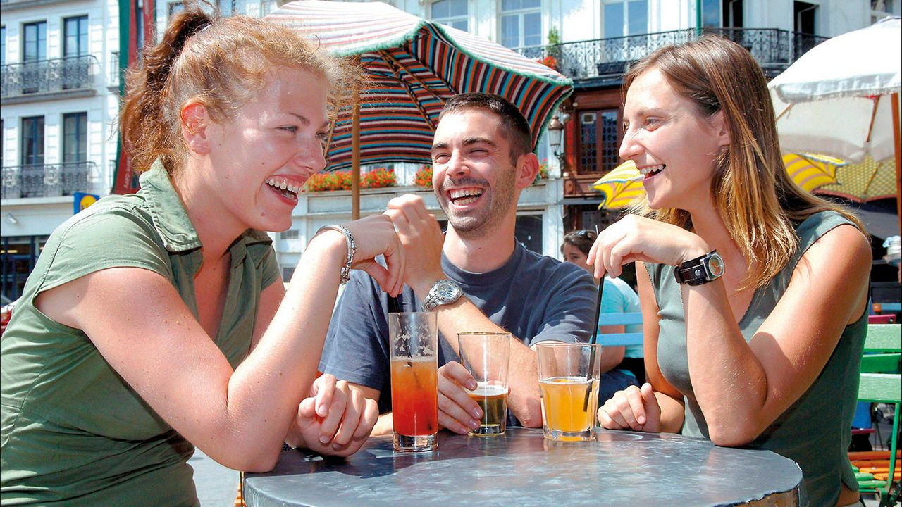 Happy people drinking outside 