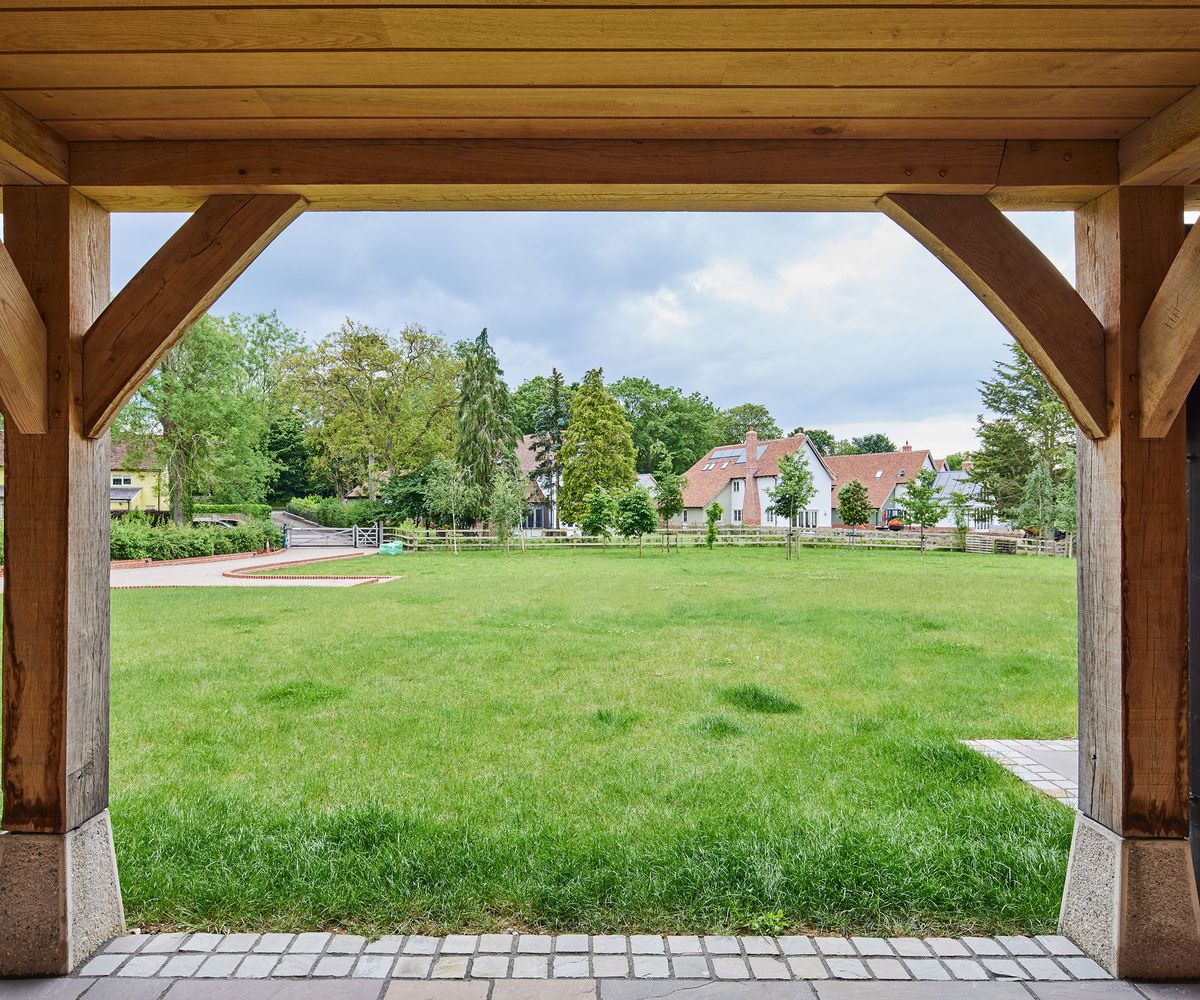 Views out of a covered porch onto a large lawn