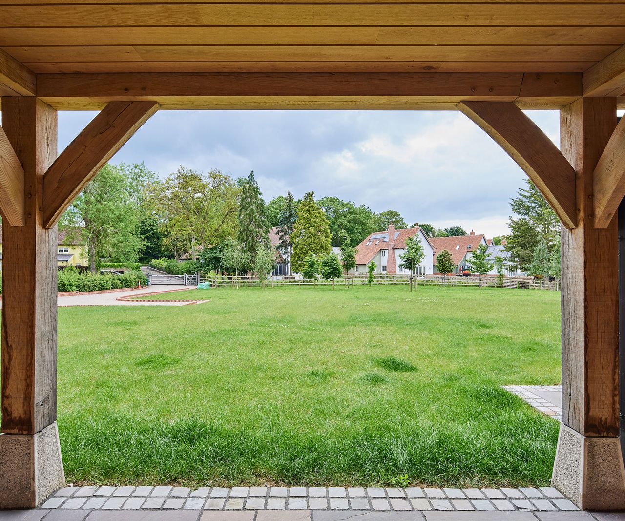 Views out of a covered porch onto a large lawn