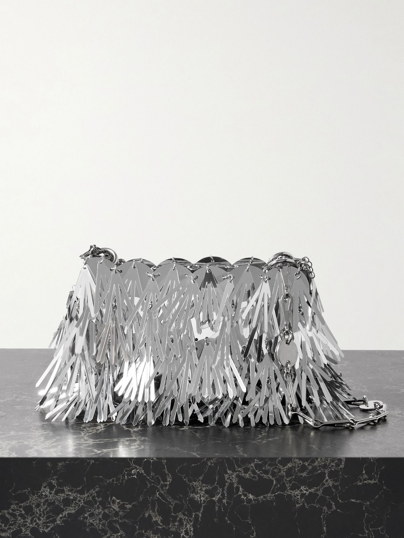 a silver embellished bag from rabanne