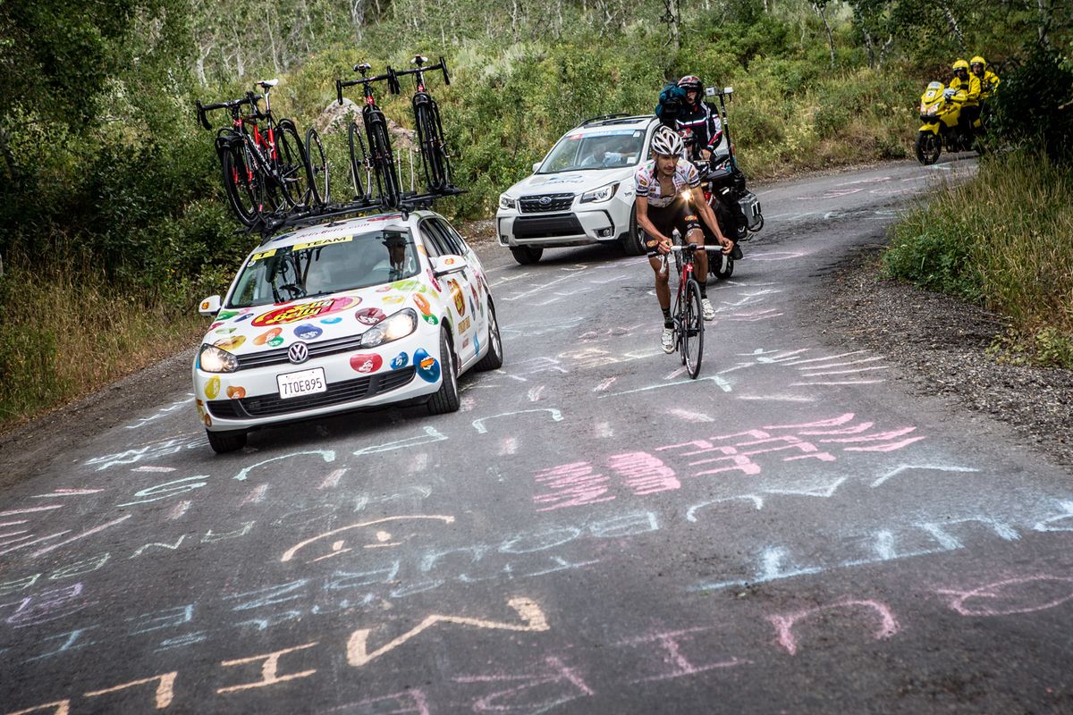 Lachlan Morton (Jelly Belly) gets encouragement from the team car