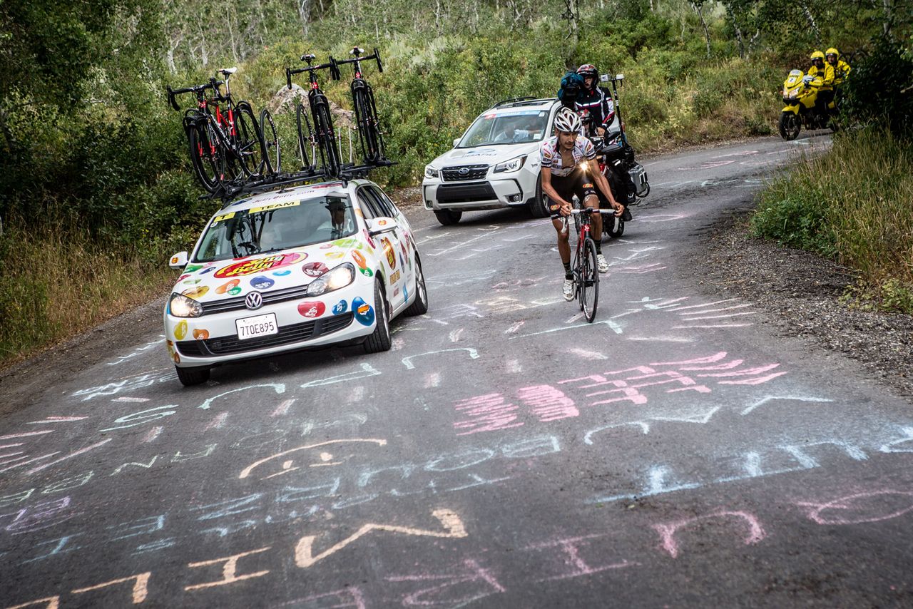 Lachlan Morton (Jelly Belly) gets encouragement from the team car