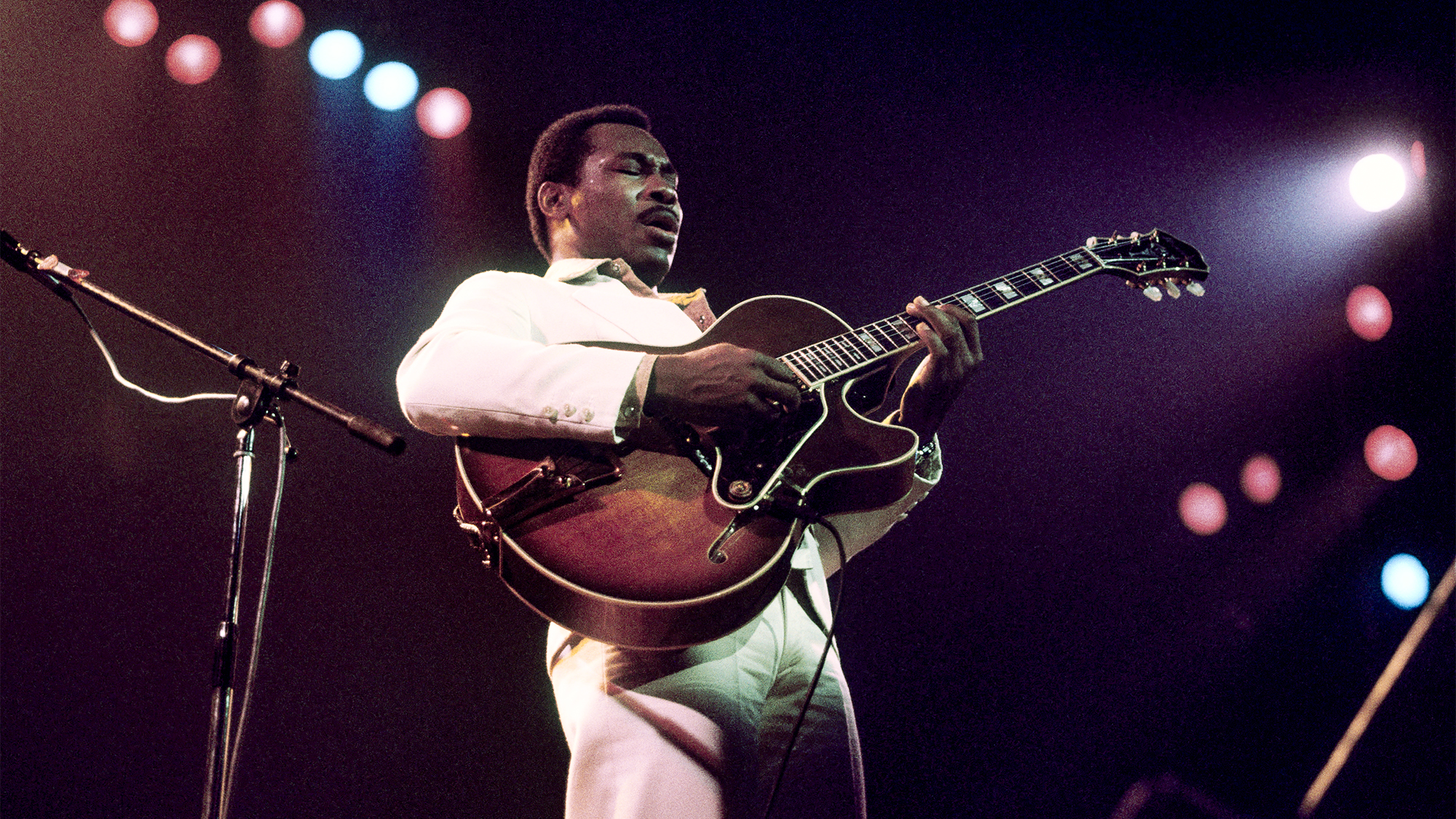 George Benson performs on stage in March 1977.